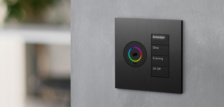 Lutron keypad mounted on a textured wall, shown with the surrounding wall and room in view